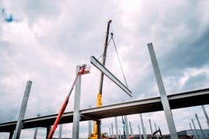 Crane lifting concrete frameworks, shutterings and heavy prefabricated concrete components